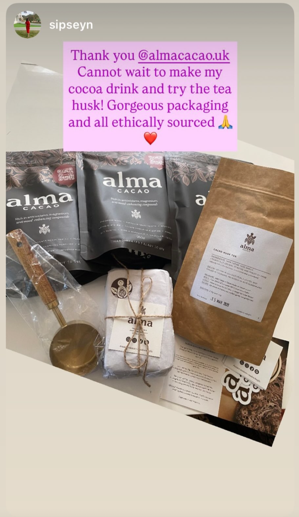Alma Cacao products including bags and a spoon on a light background