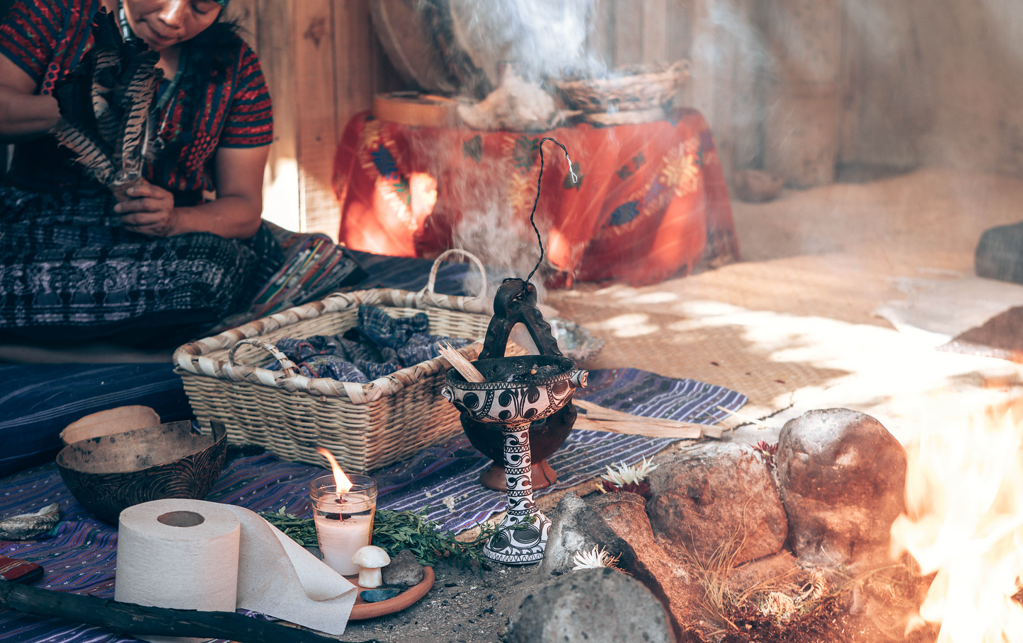 Person sitting in traditional mayan cacao ceremony